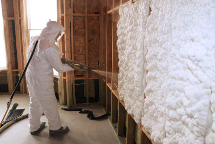 person applying spray foam insulation